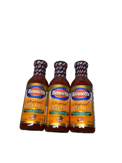Three bottles of Bunnell's Original Hot Sauce on a textured surface